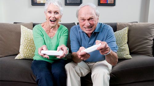 Elderly couple playing the Nintendo Wii