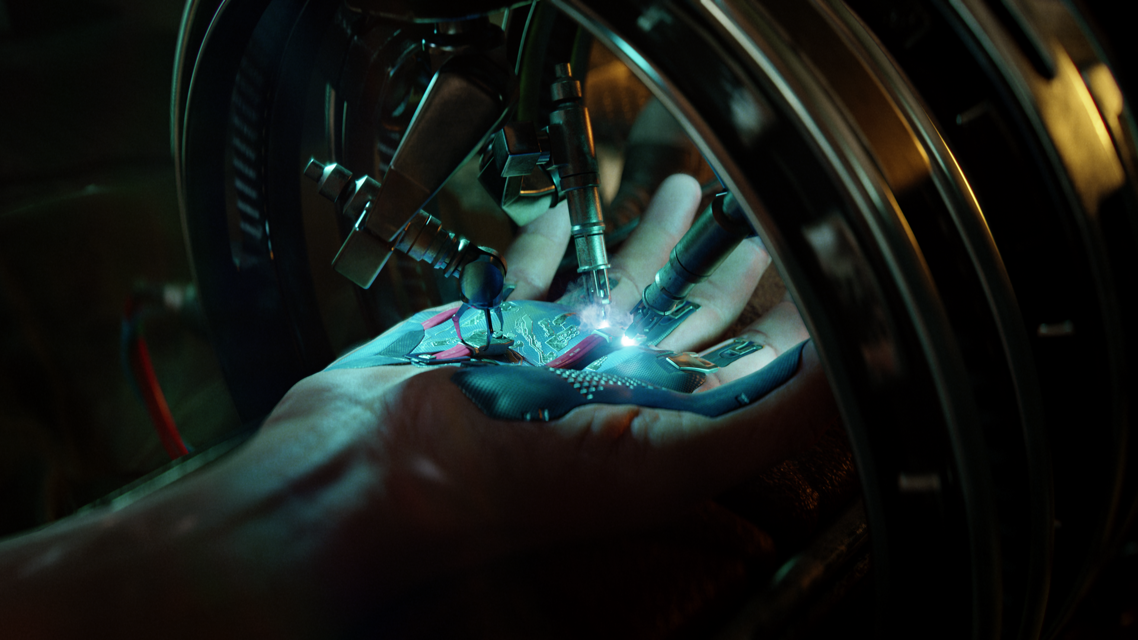 Cyberpunk 2077 key art showing a hand under a blue light being jabbed with robotic needles