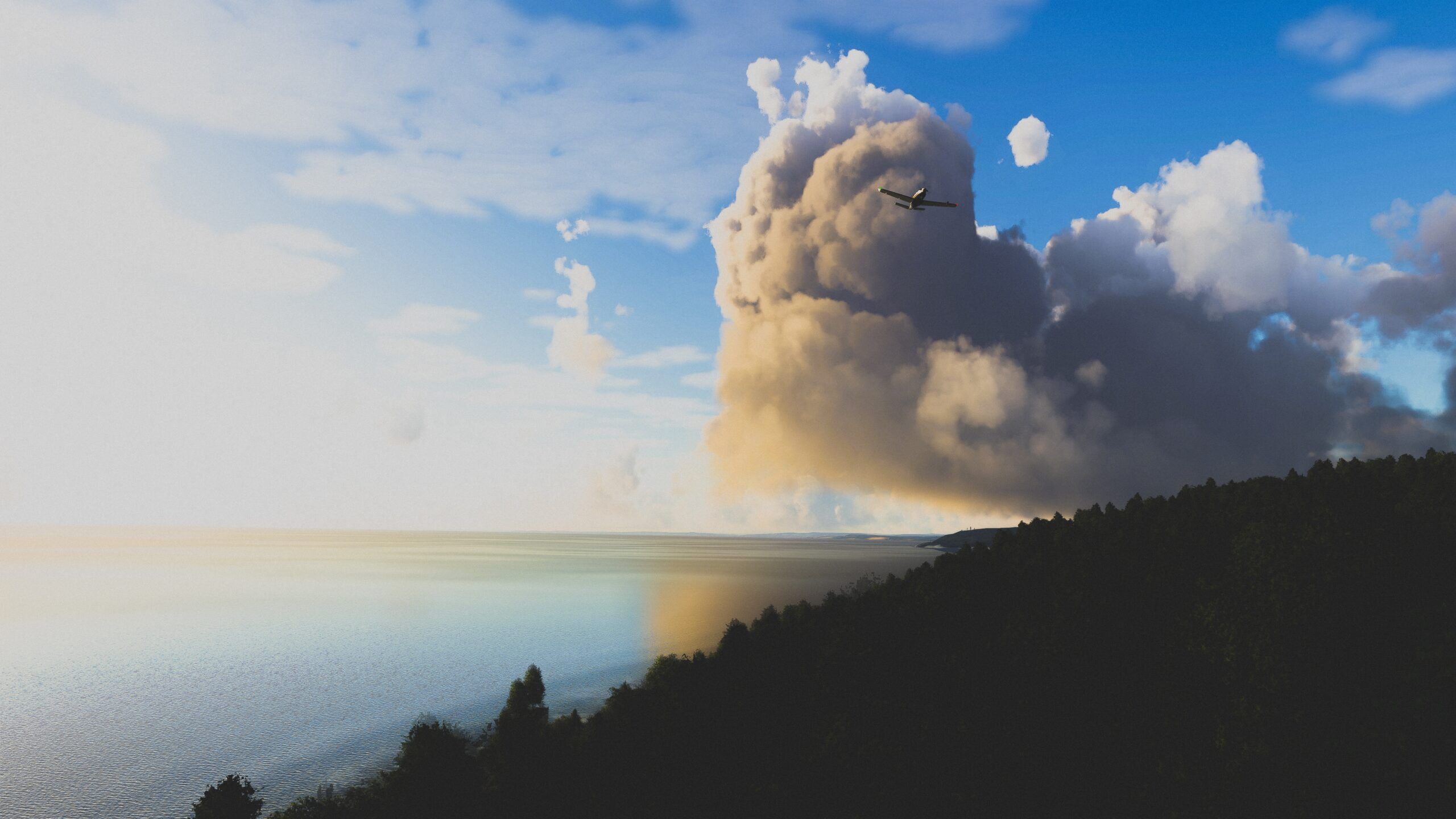 Microsoft Flight Simulator plane flying in front of giant cloud by cliffs and trees
