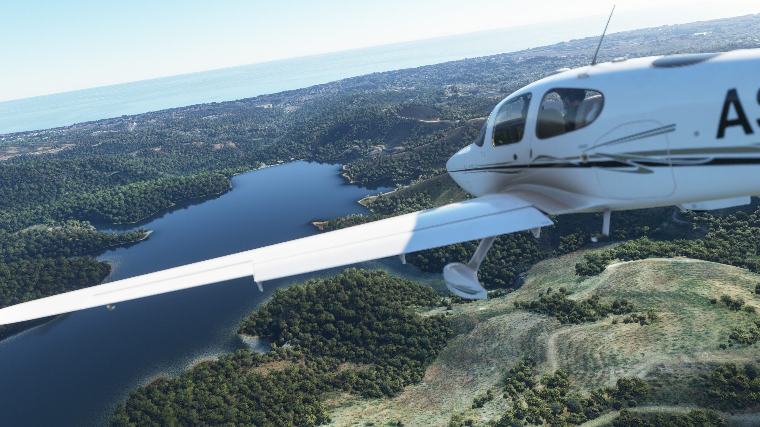 Microsoft Flight Simulator plane flying toward a large lake
