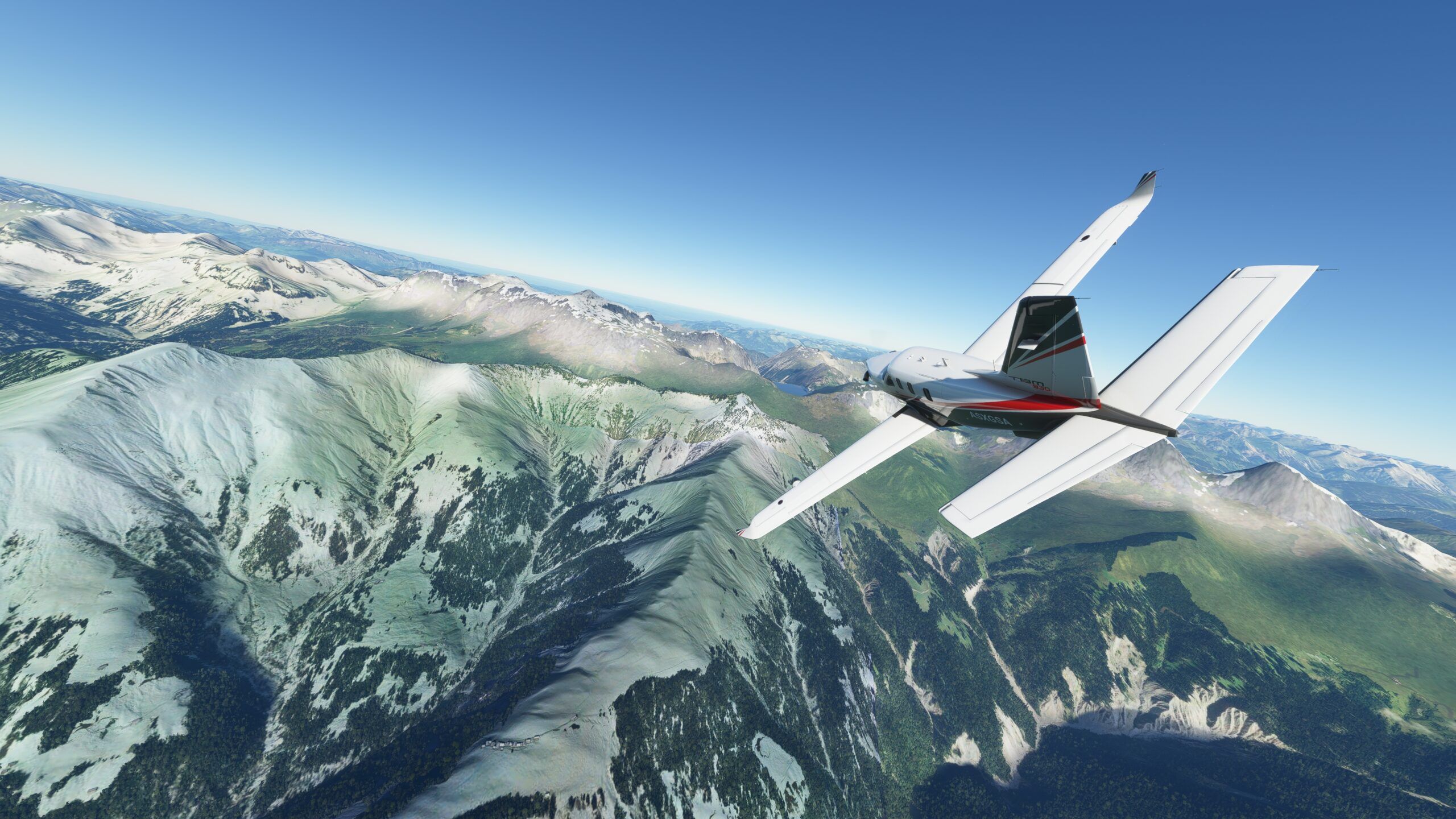 Microsoft Flight Simulator plane flying over snow-tipped mountains