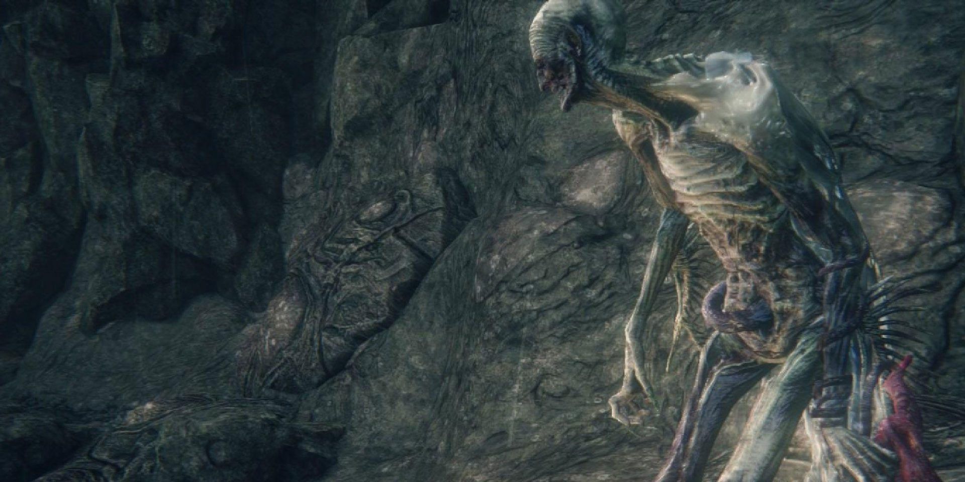 Bloodborne The Old Hunters DLC final boss, Orphan of Kos, emerging to face the player.