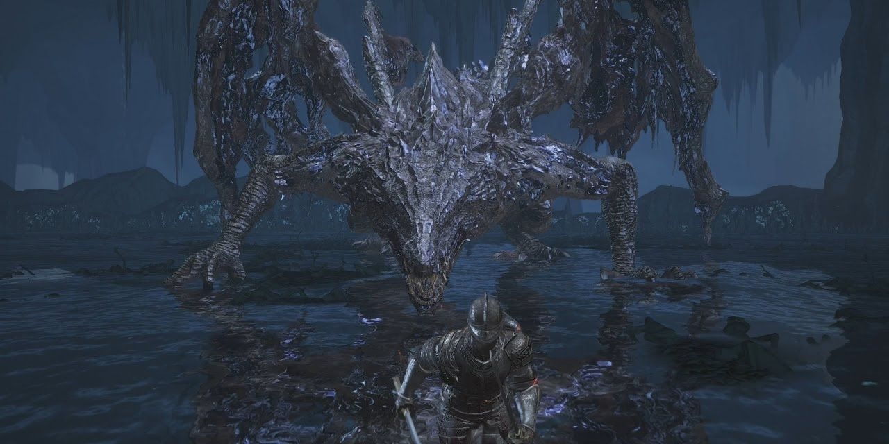 The Ashen One sprints away from the massive dragon Midir in a pool of water.