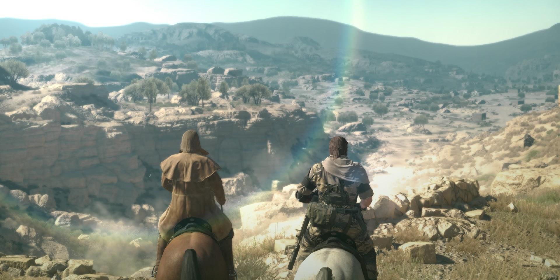 Venom Snake and Revolver Ocelot gaze out over Afghanistan in Metal Gear Solid 5.