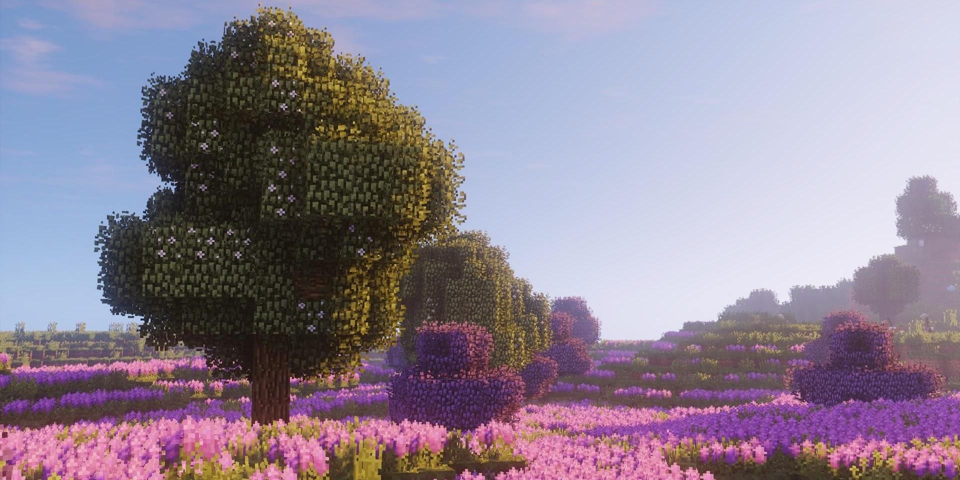 A peaceful flowery field with trees in Minecraft.