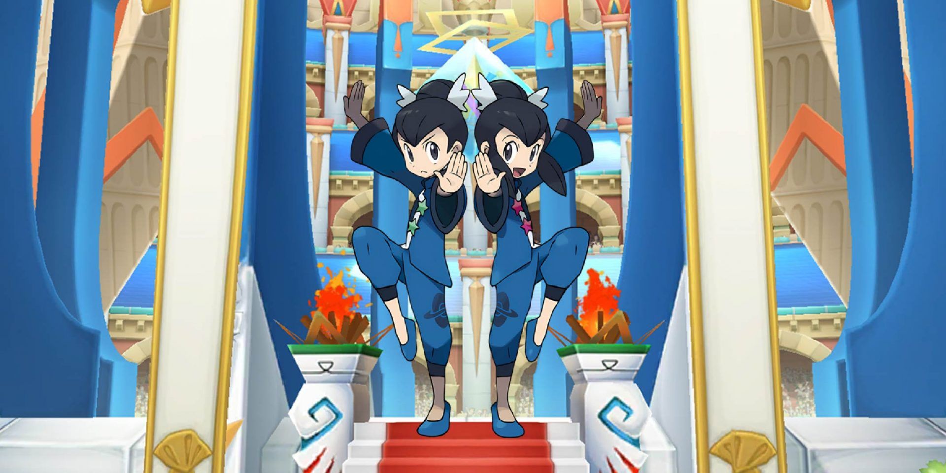 Tate and Liza from Pokémon standing against an arena backdrop.