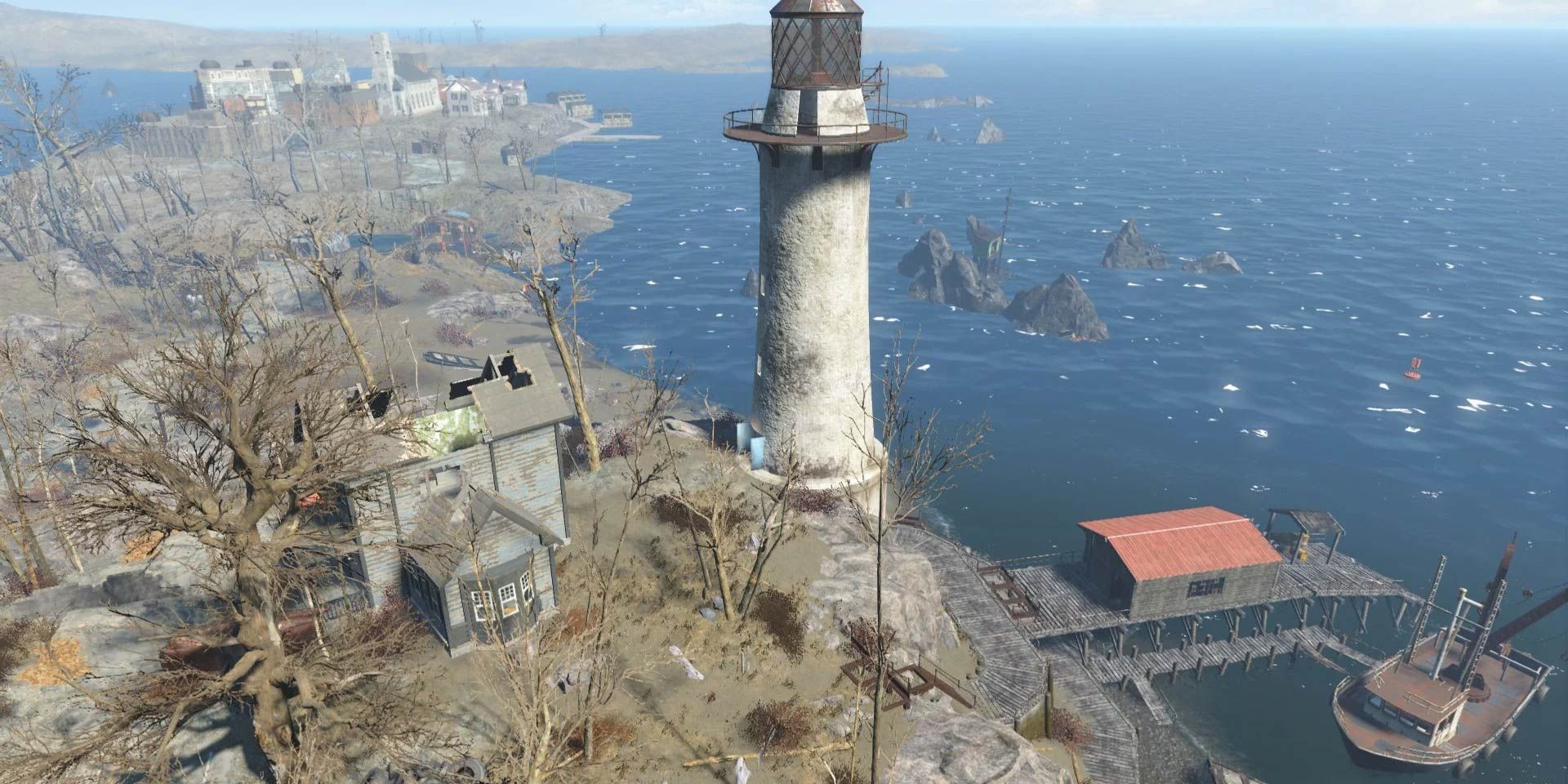 Kingsport Lighthouse in Fallout 4; a lighthouse on the coast near a small dock.