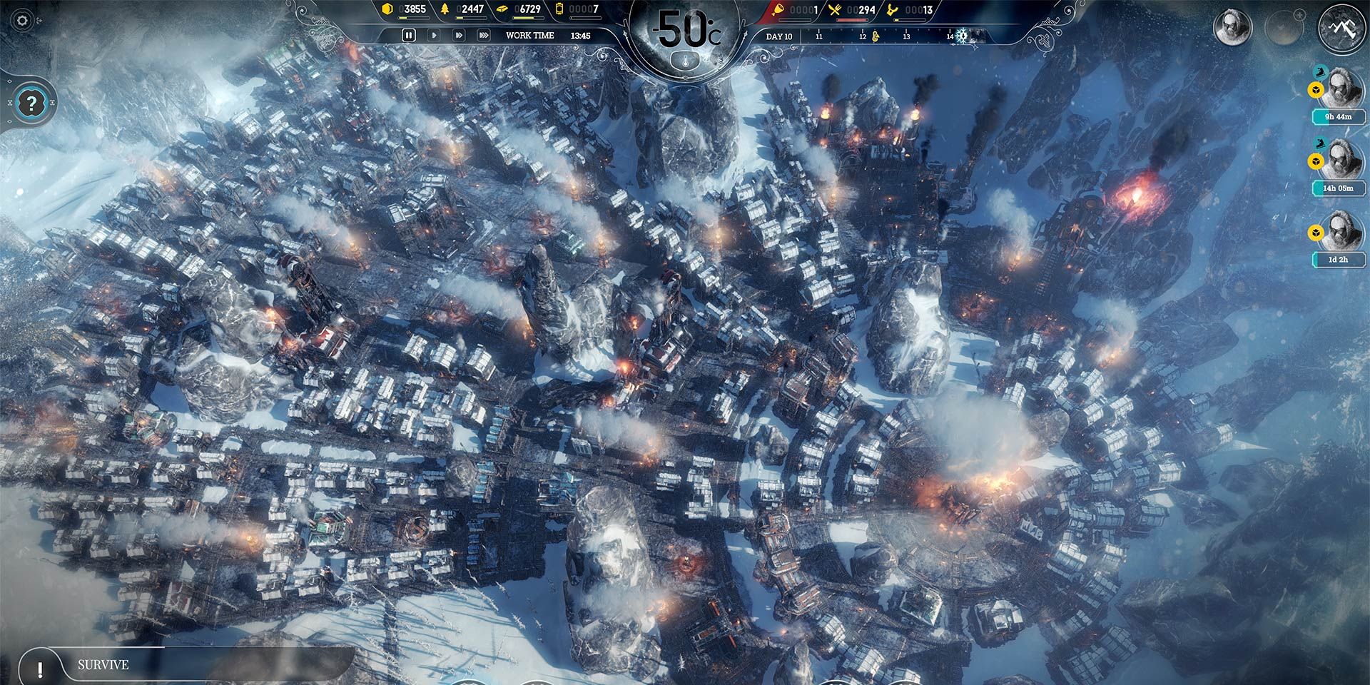 A relatively huge settlement in Frostpunk. Snow covered buildings fill the screen.