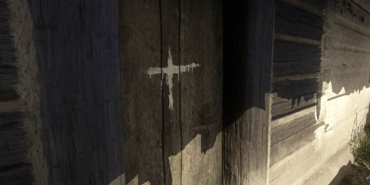 A door marked with a cross to designate sick inhabitants in Kingdom Come: Deliverance.