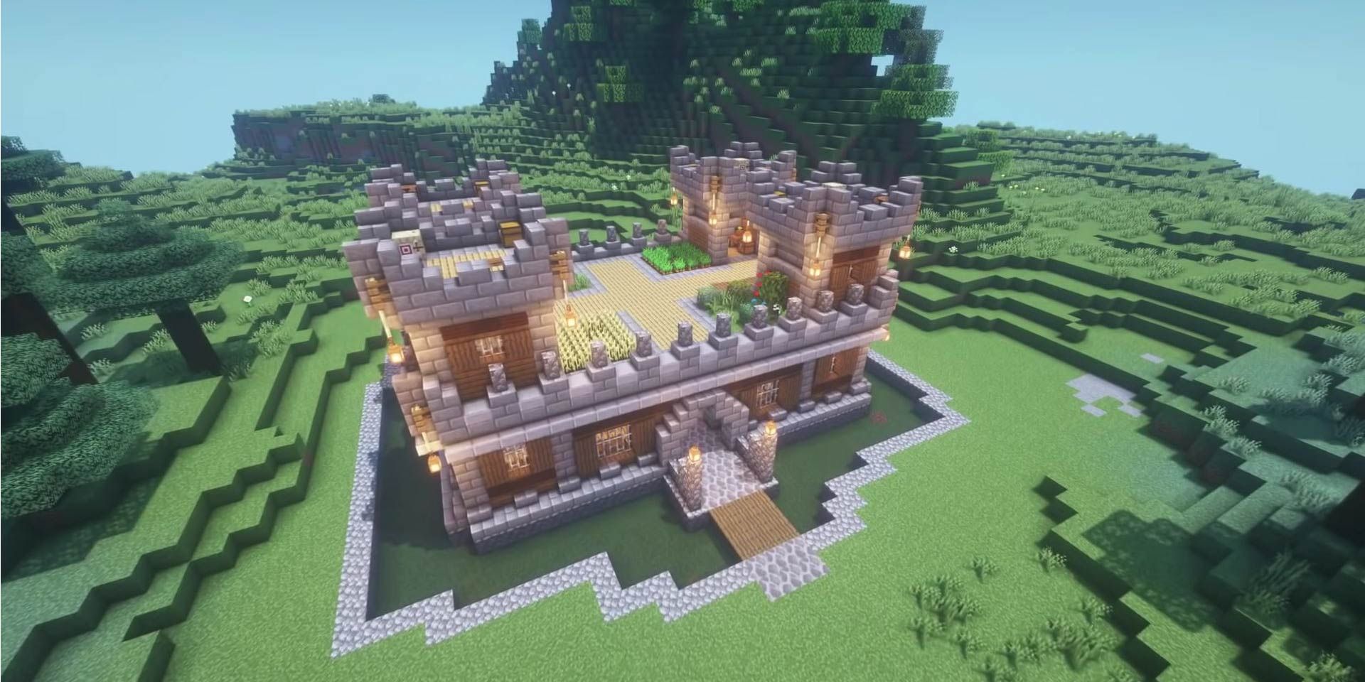 A relatively small but functional castle in a field in Minecraft.