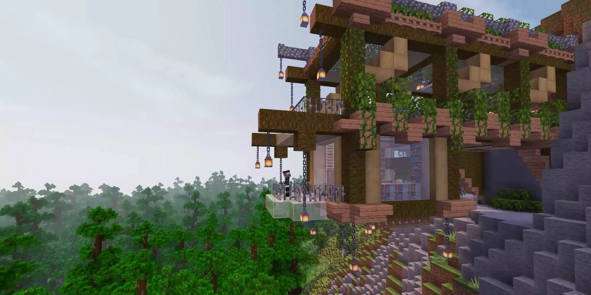 An ornate wooden house affixed to the side of a rocky cliff in Minecraft.