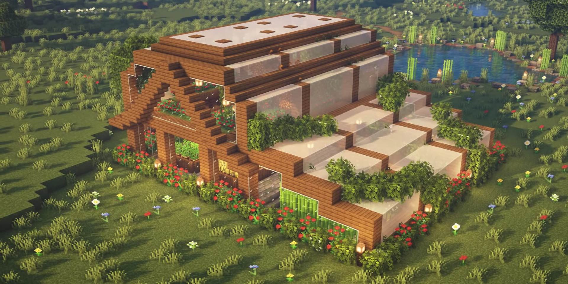 A medium-sized greenhouse in a field in Minecraft.