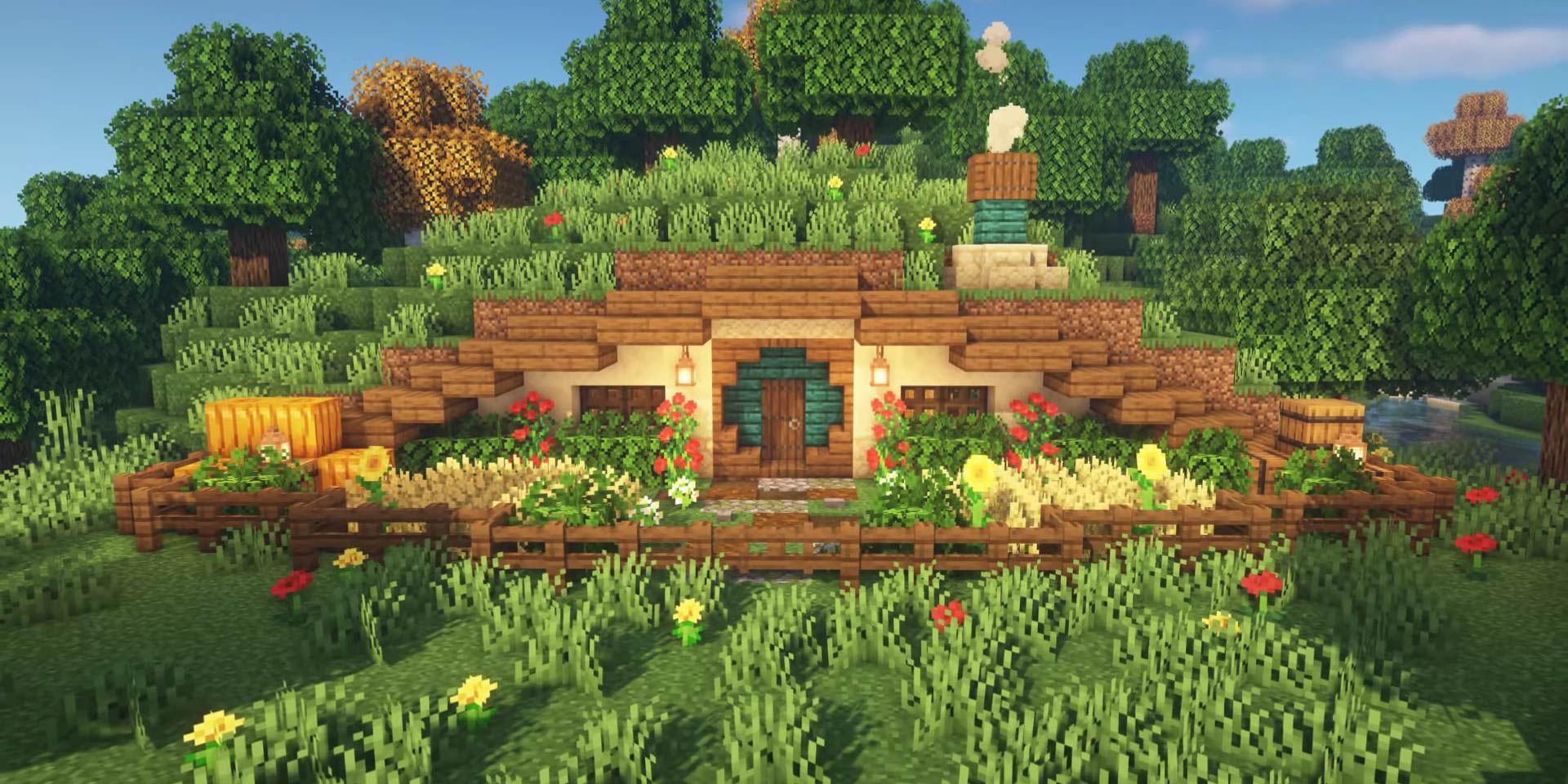 A cozy hobbit house built into the side of a hill in Minecraft.