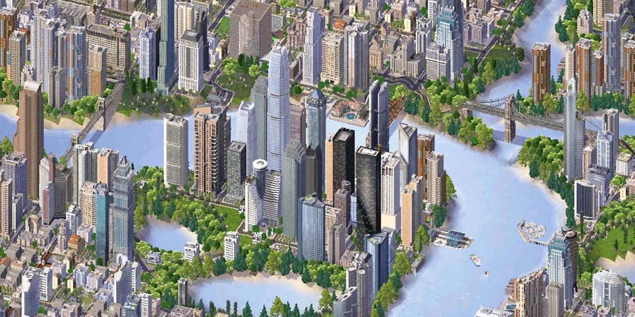 A city in SimCity 4 with big skyscrapers on the side of a wide river.