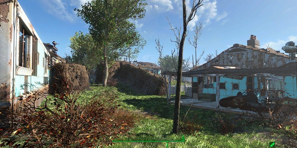 Fallout 4 settlement featuring abandoned buildings and lush vegetation