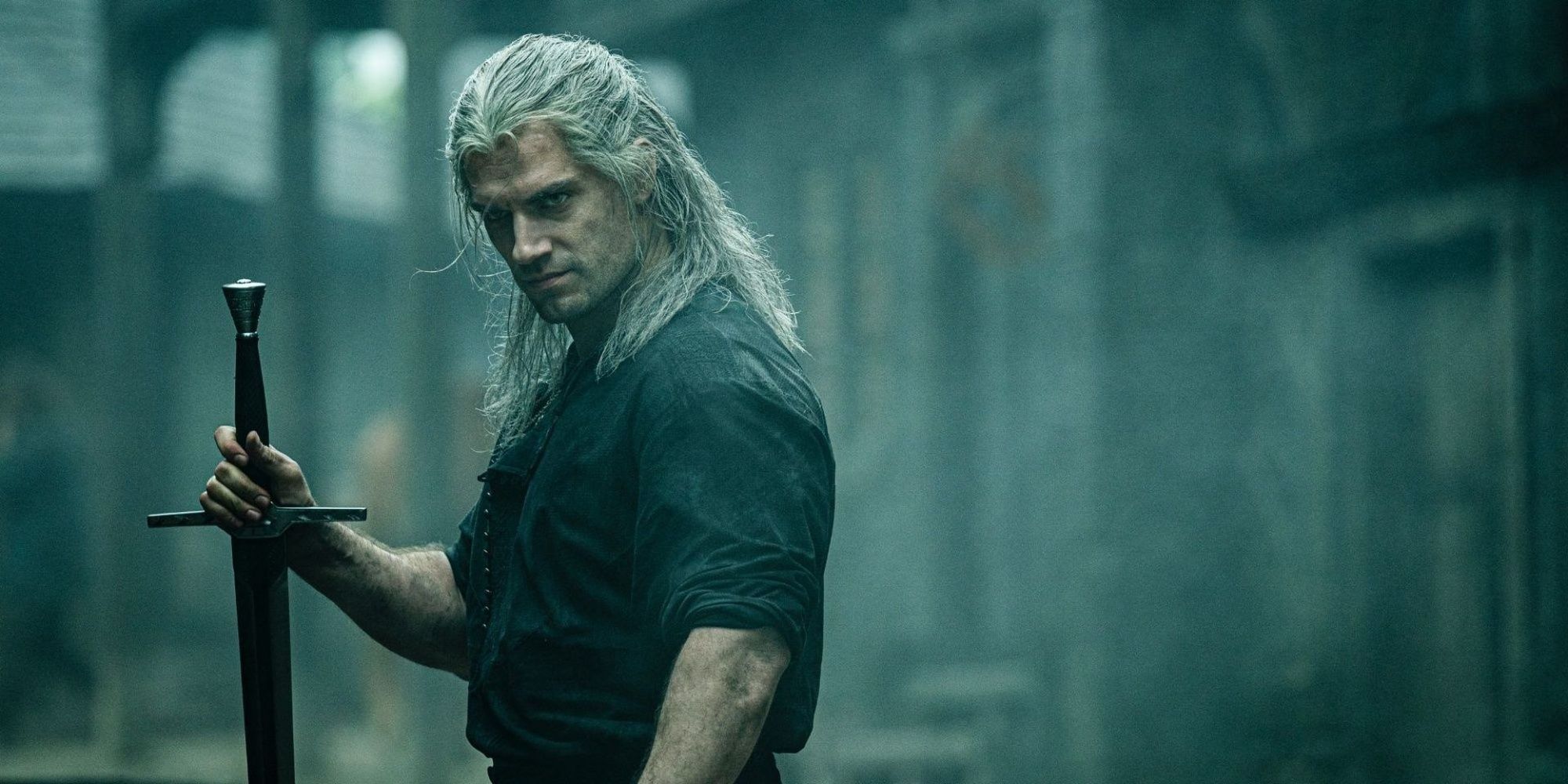 Henry Cavill as Geralt in Netflix The Witcher Holding Sword