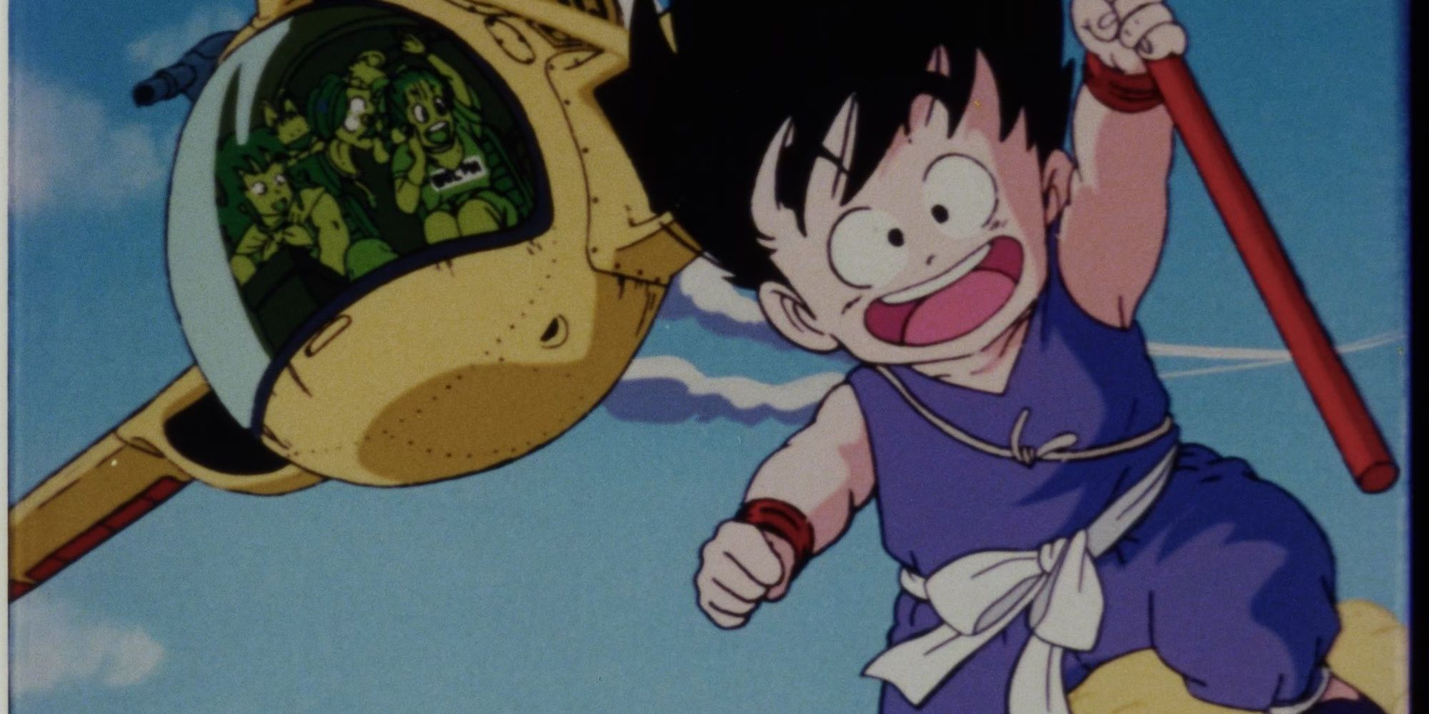 Goku rides the Nimbus in front of his friends in a helicopter in Dragon Ball