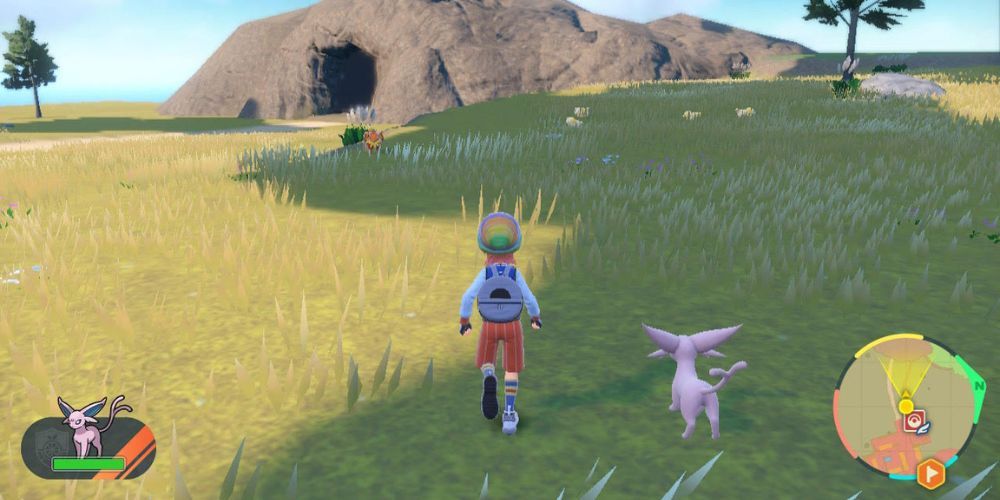 A trainer and Espeon walking together in Pokémon Scarlet & Violet.