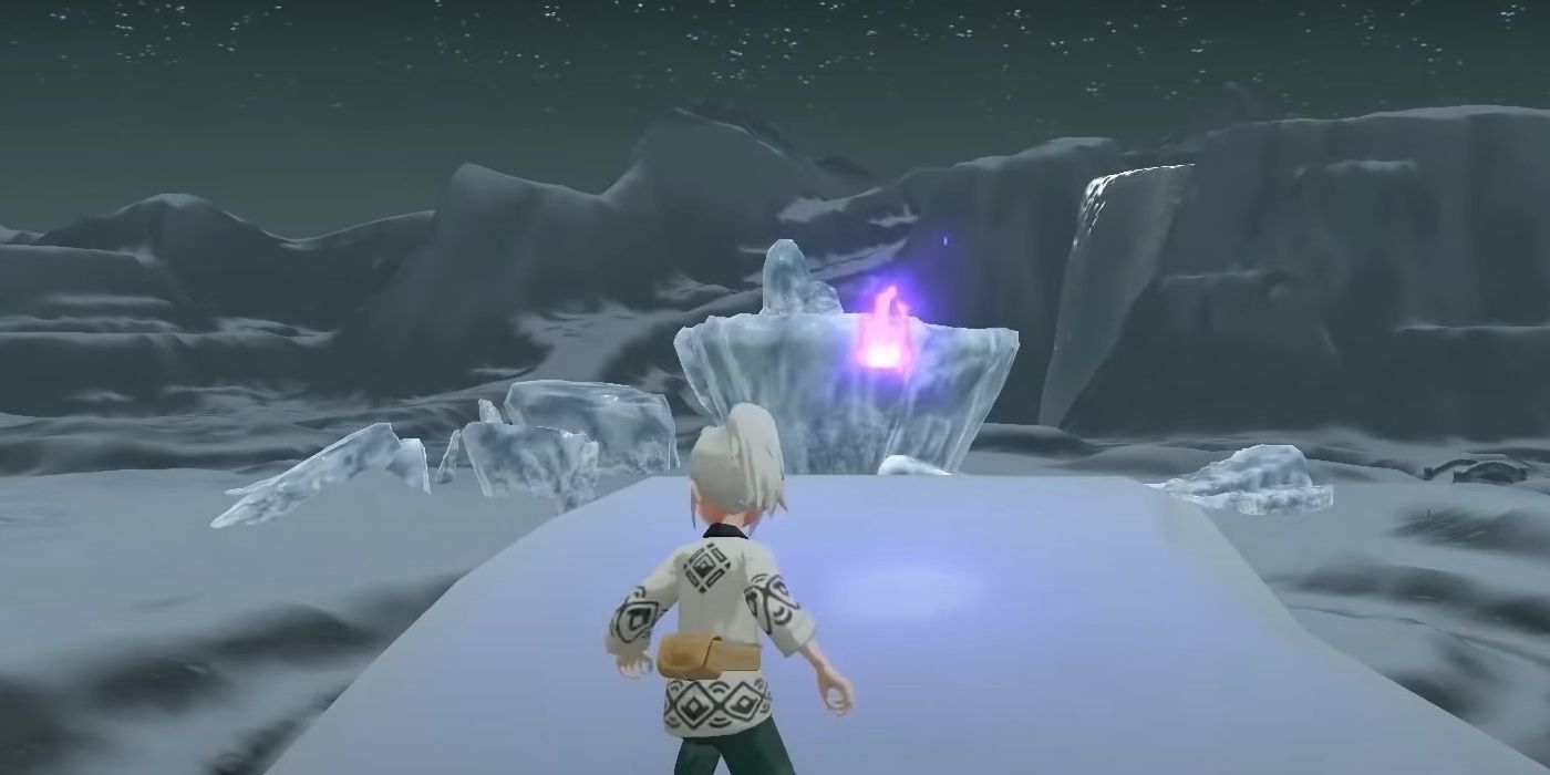 The Pokemon Legends Arceus character finds a wisp on a large snow covered rock in Avalugg's Legacy overlooking ice formations beneath the night sky in Alabaster Icelands.