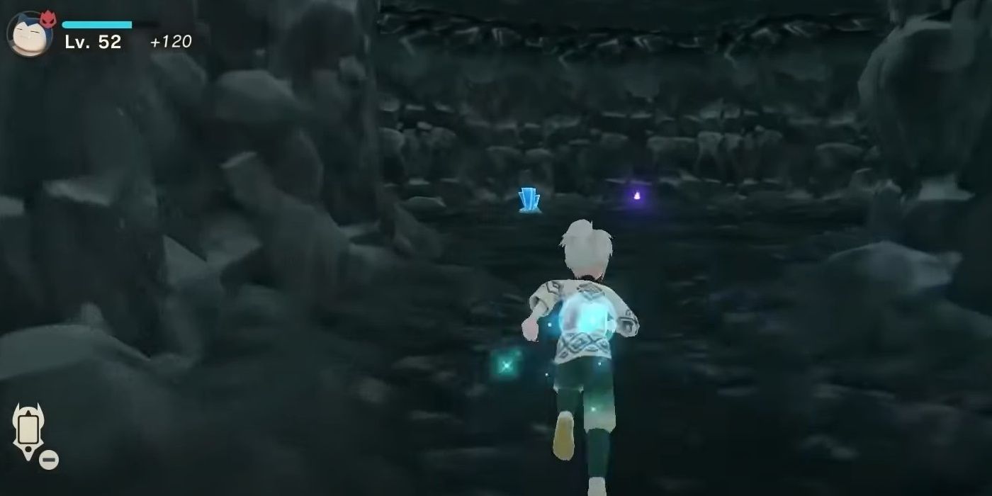 A Pokemon Legends Arceus character is running into a Lake Acuity hidden cave towards a wisp in Alabaster Icelands.