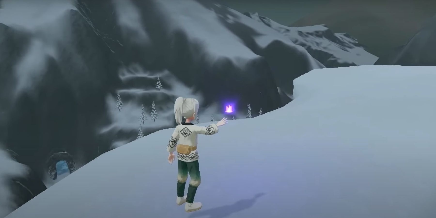 A character in Pokemon Legends Arceus finds a wisp resting on a small ledge on the side of a Whiteout Valley mountain overlooking a portal door, mountain range, and snow covered trees in Alabaster Icelands.