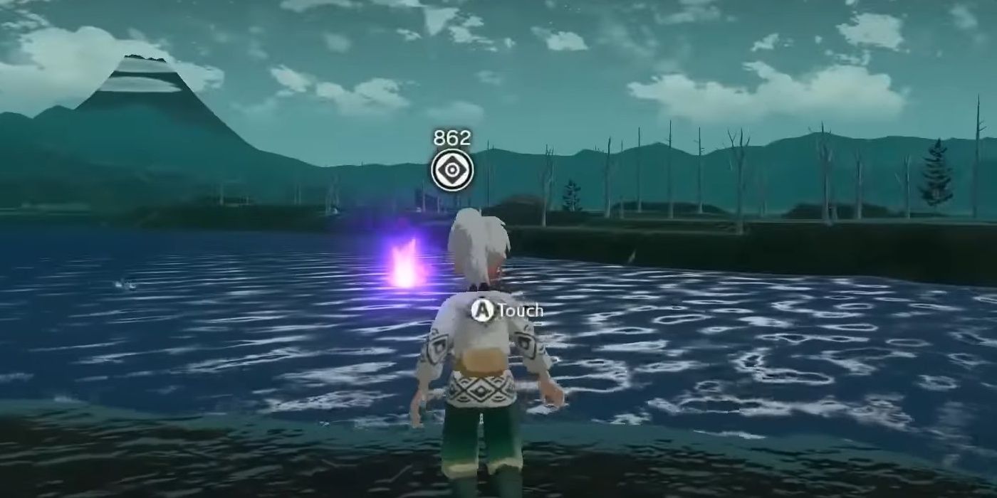 On a Tombolo Walk, Pokemon Legends character Arceus finds a tuft on a single piece of rock in the middle of the ocean overlooking dead trees and a volcano in the Cobalt Coastlands.