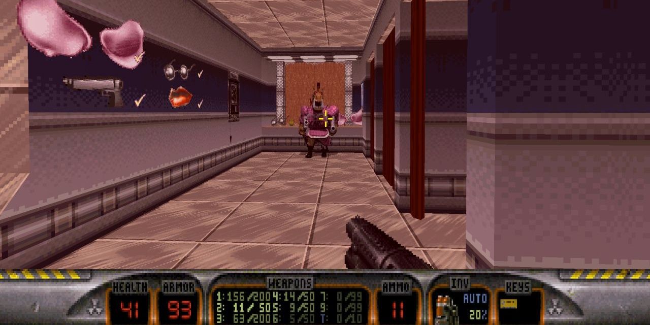 duke shoots an alien in a hallway