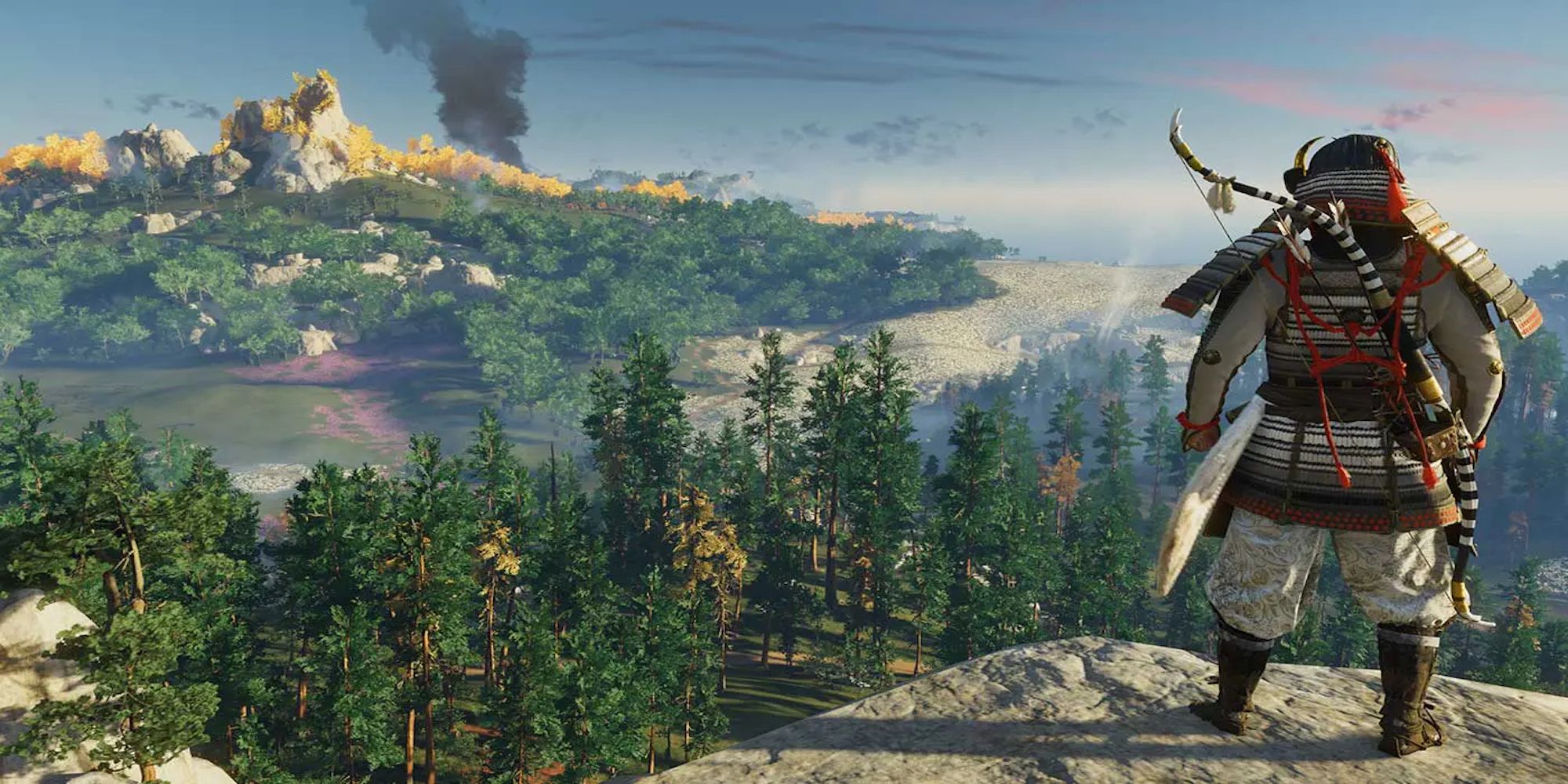Player standing over a cliff, looking at the forest (Ghost of Tsushima)