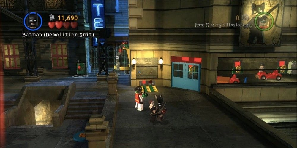 Screenshot from Lego Batman: The Videogame, featuring Robin and Batman in a street.