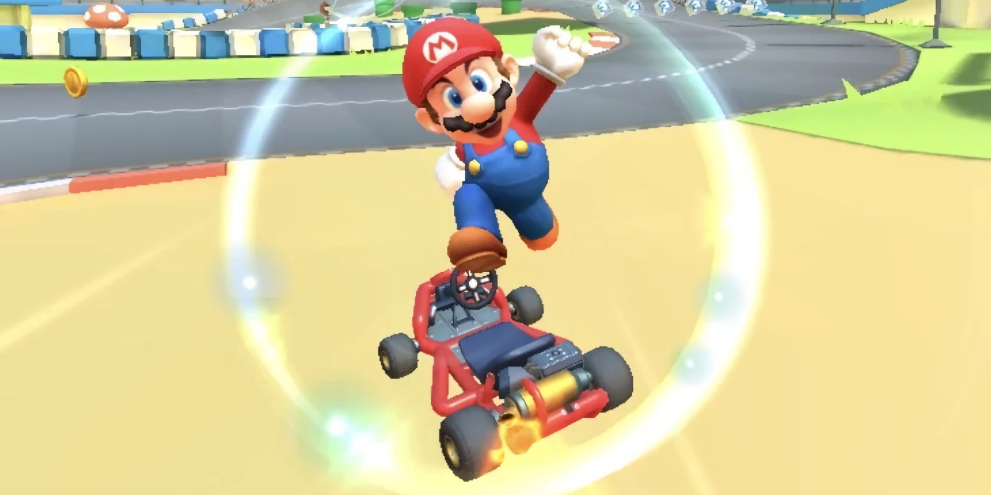 Mario Kart Tour Mario performs a trick on the frog arena