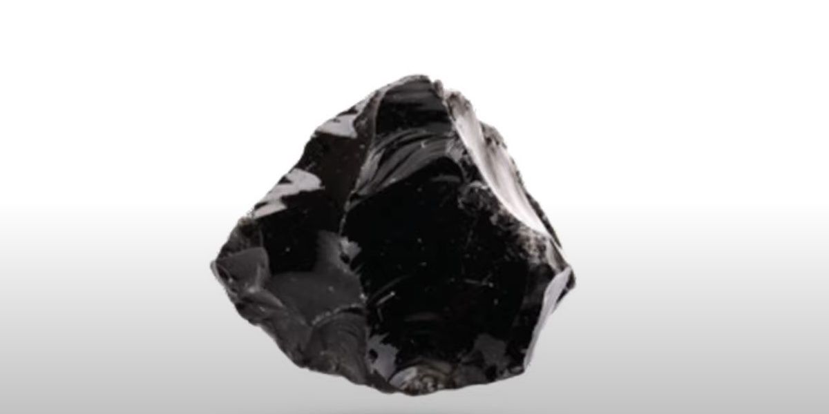 A piece of shiny black obsidian can be found in Ark Survival Evolved.