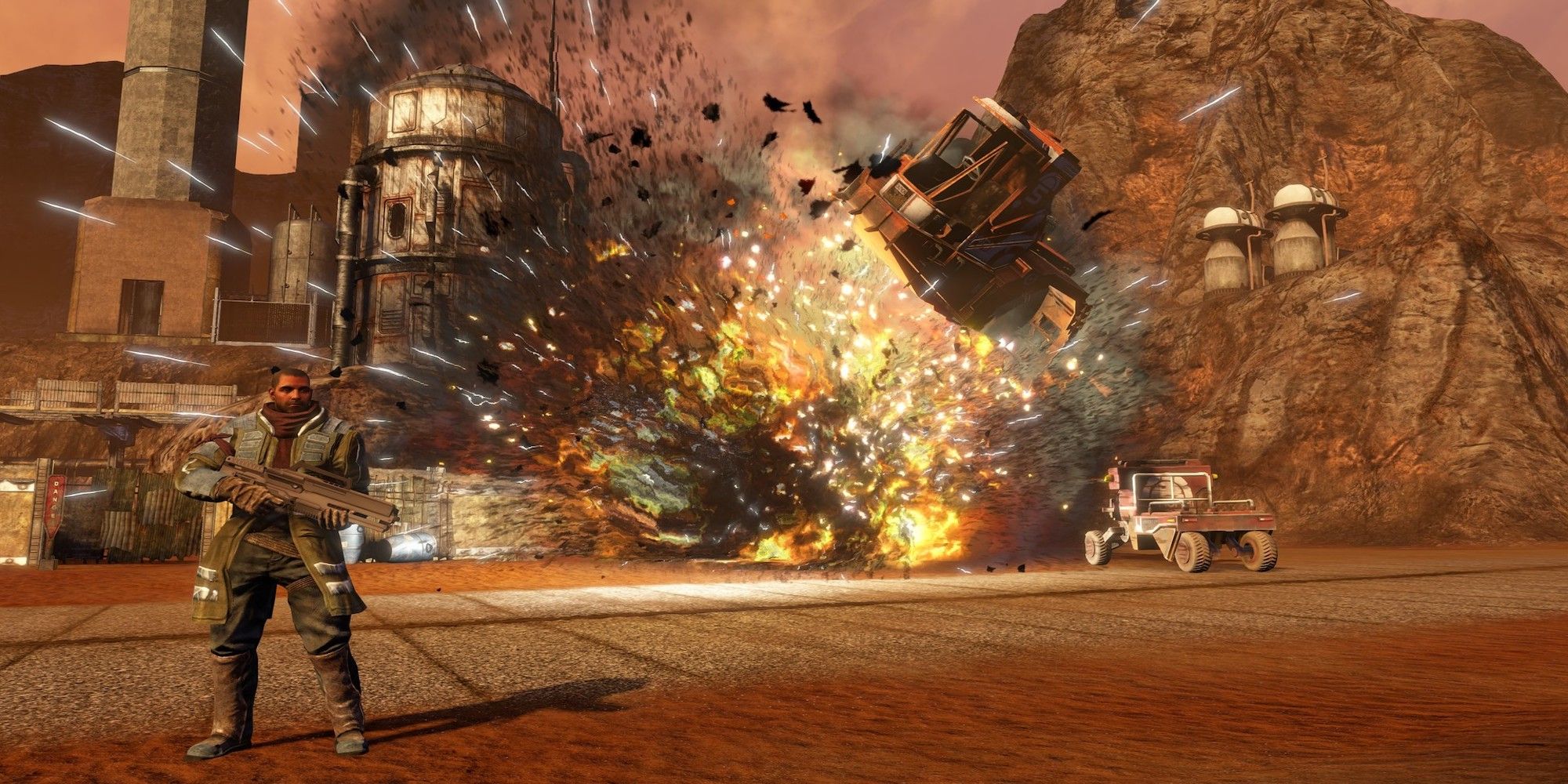 Alec Mason standing in front of an explosion (Red Faction: Guerrilla)