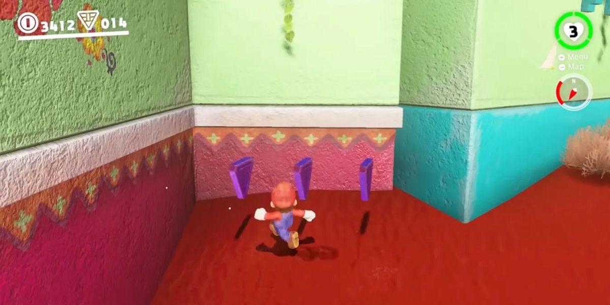 Super Mario Odyssey Sand Kingdom Mario collects purple coins from around the back of the building