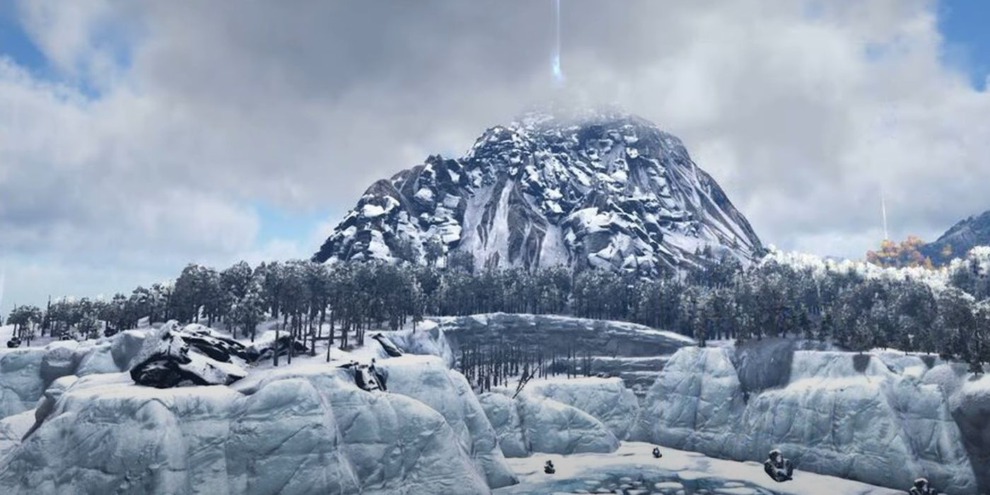 A character in Ark Survival Evolved is looking out over Whitesky Peak with the base of the mountain covered in snow and trees.