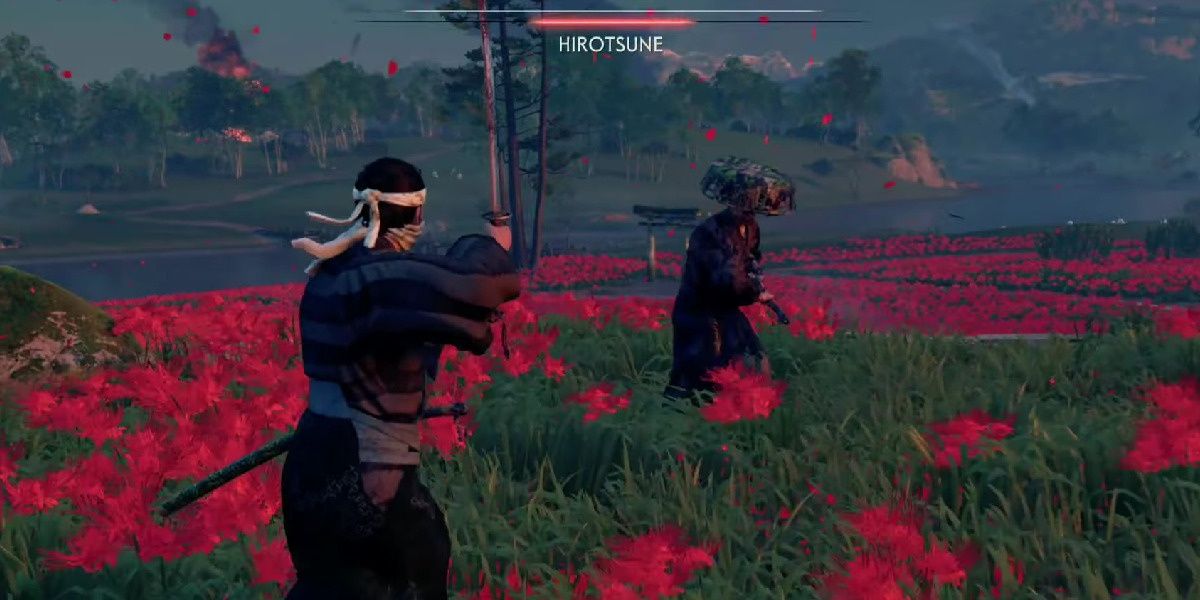 Hirotsune fighting in a field of spider lilies in Ghost of Tsushima