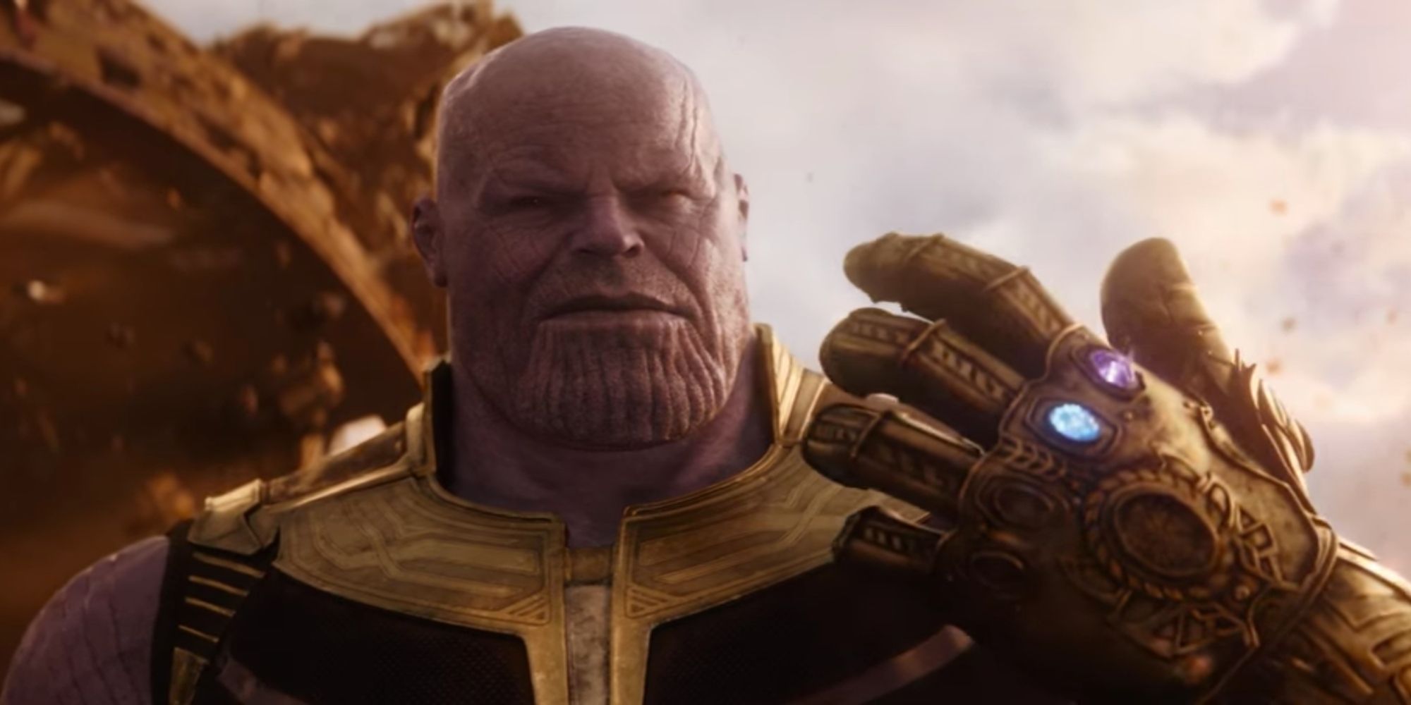 thanos holds the infinity gauntlet on titan in infinity war