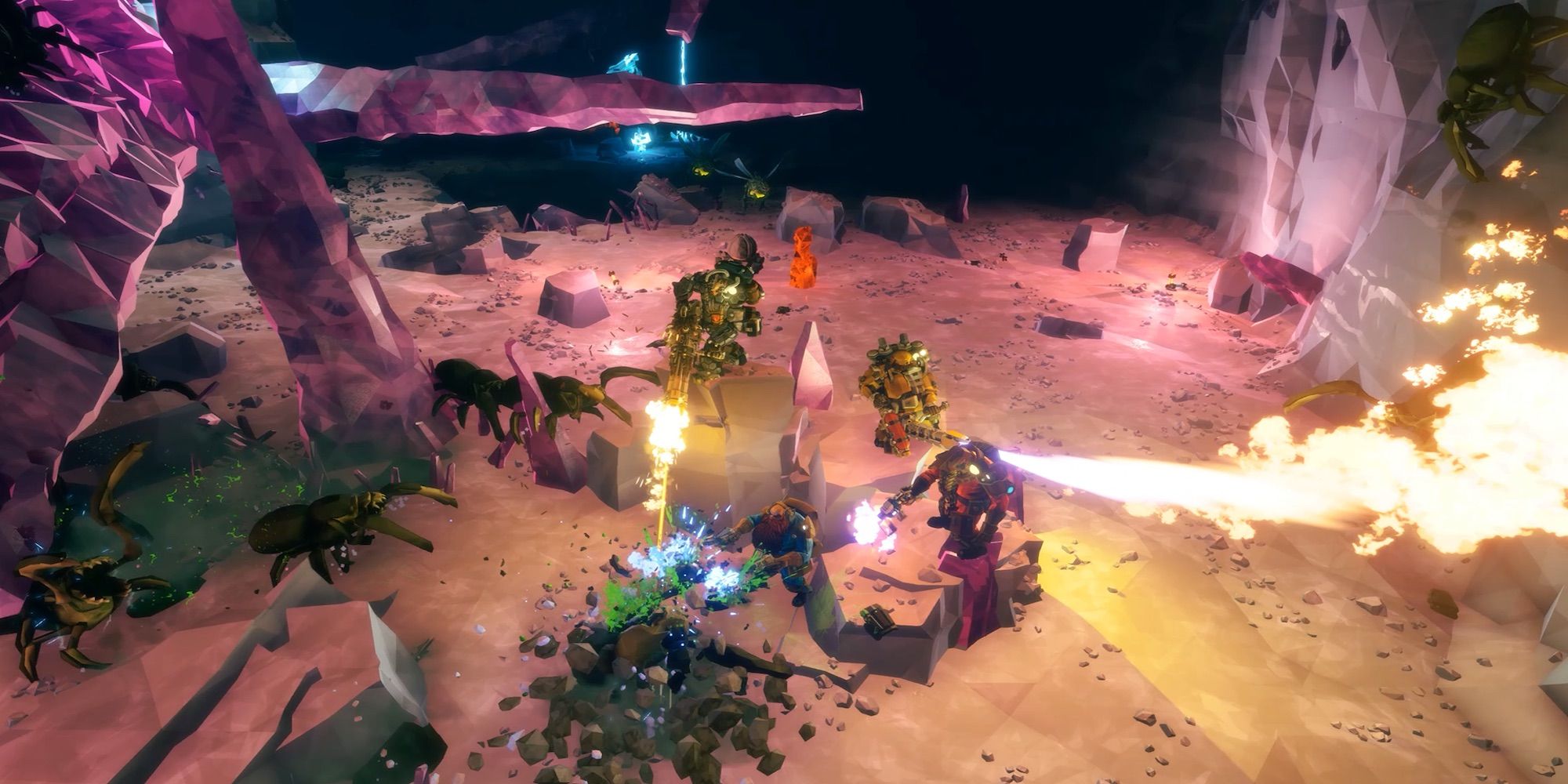 Players fighting enemies in the mines (Deep Rock Galactic)