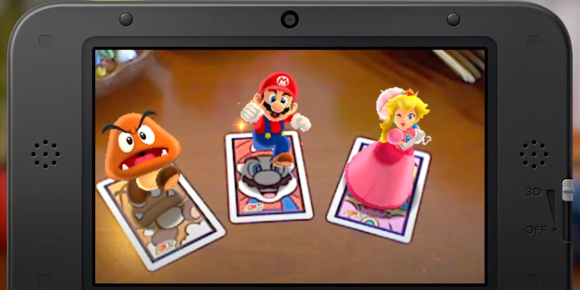 Mario, Princess Peach, and Goomba on the Nintendo 3DSXL screen