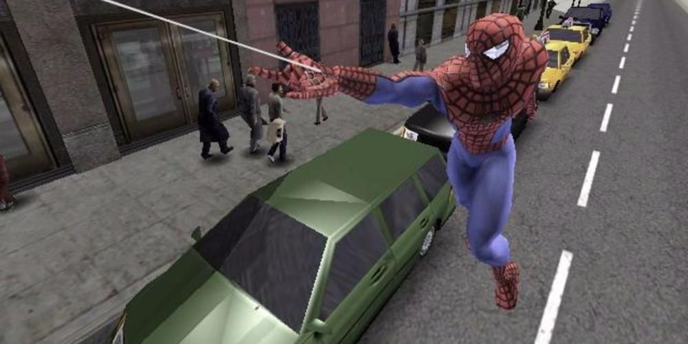 Spiderman firing a web to swing upward. Behind him is a city street and pedestrians