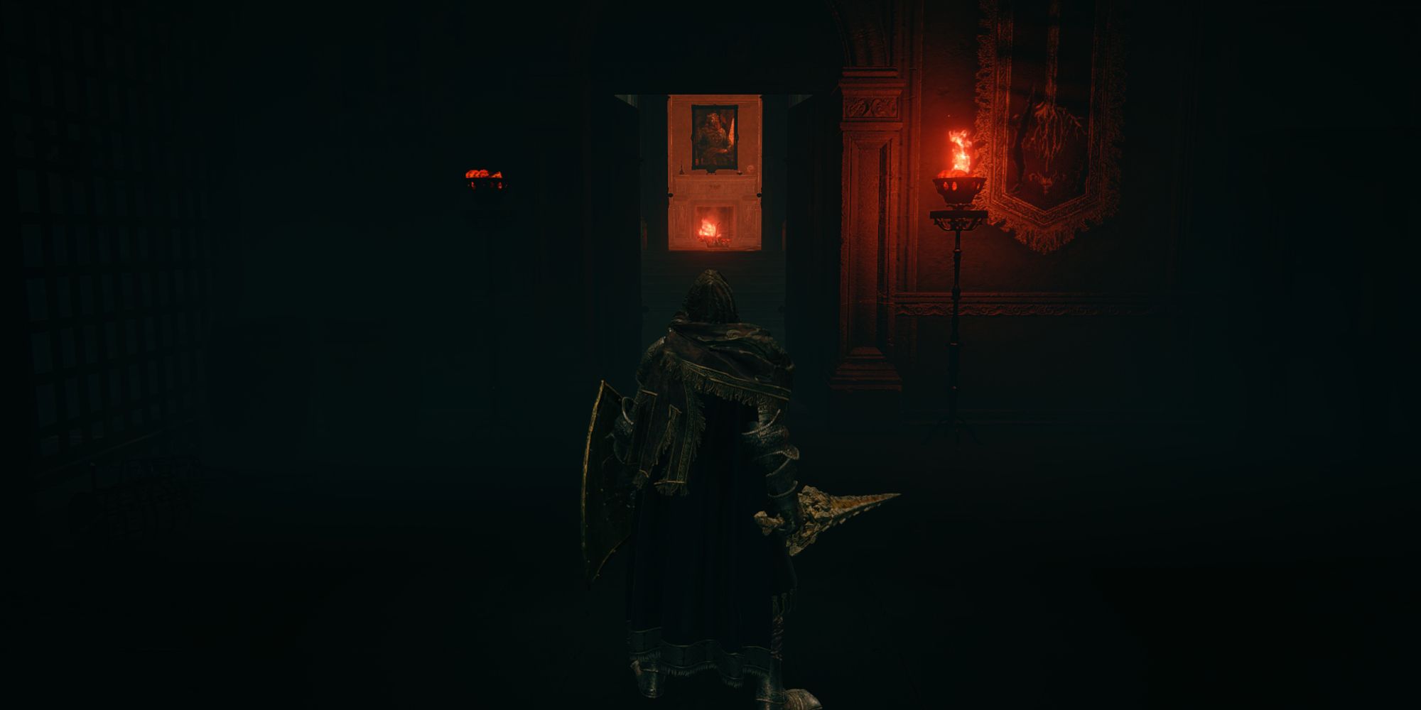 Tarnished standing in a dark hall way in Volcano Manor, in front of the Royal Knight's Resolve Ash of War location.