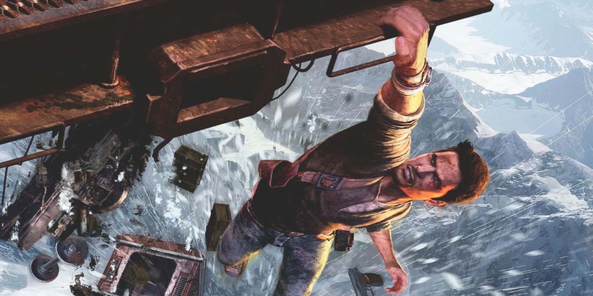 Nathan Drake from the Uncharted Franchise hangs precariously from a ledge.