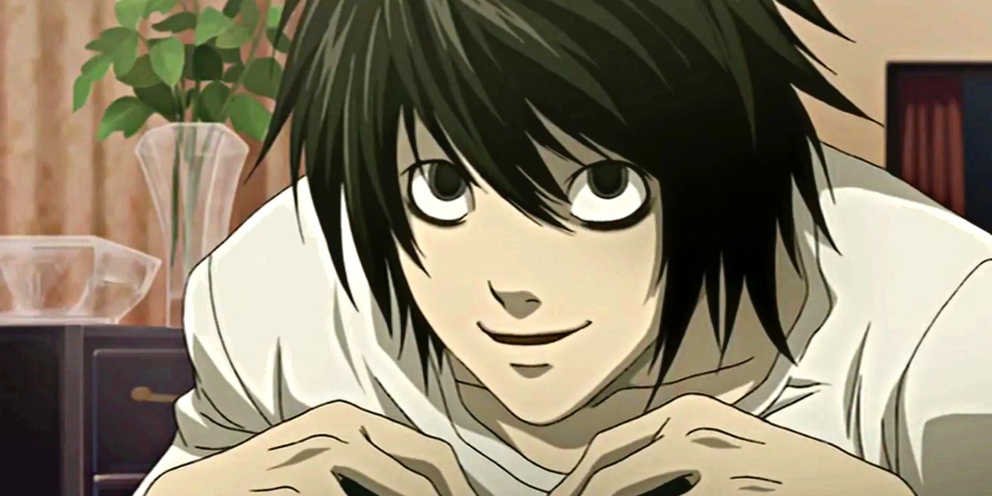 L Lawliet from Death Note smiles as he talks about Kira's capture.