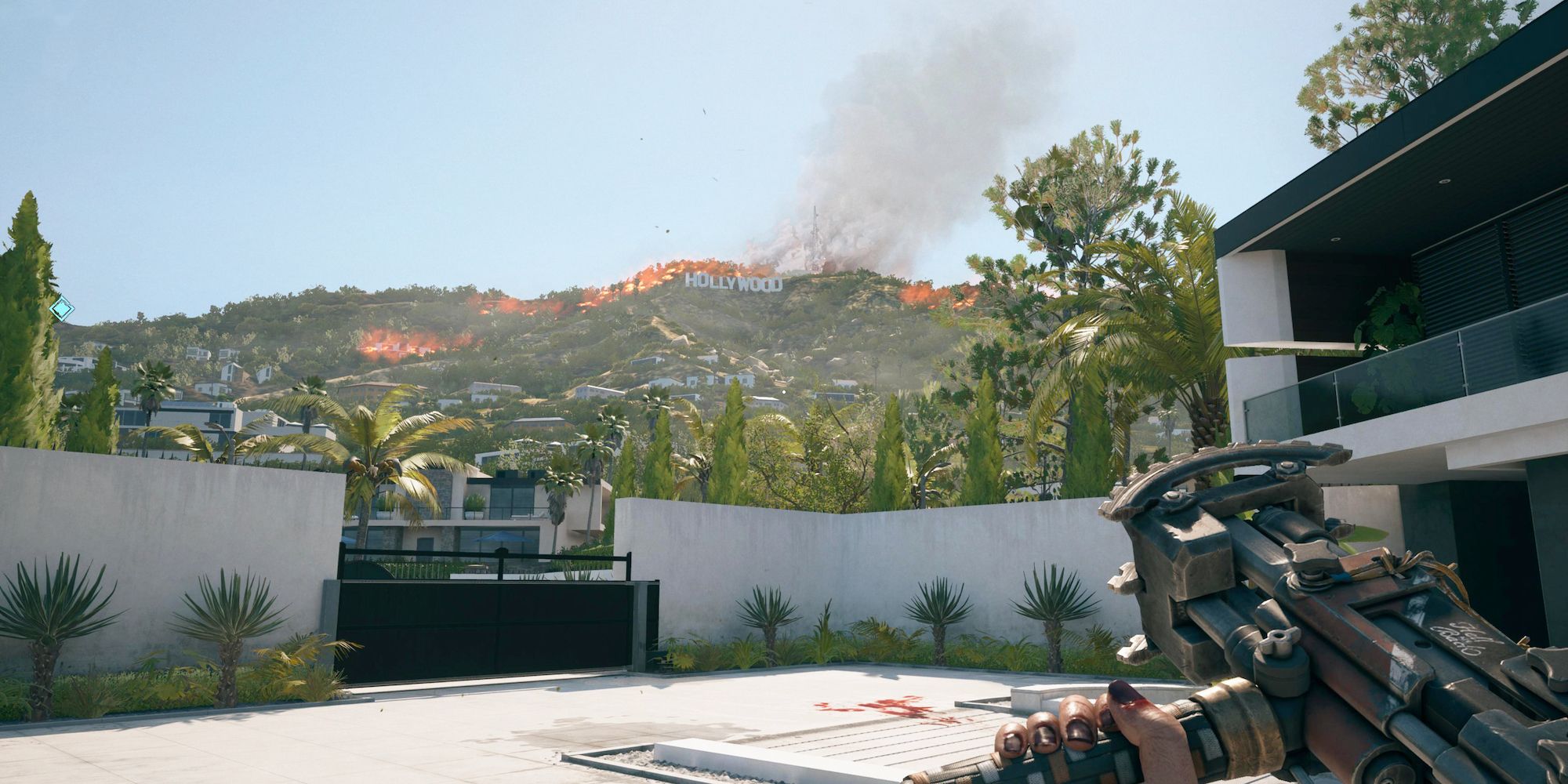 A view of the burning Hollywood sign on Dead Island 2.