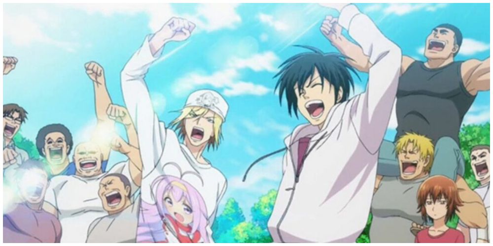 Iori Kitahara and the diving club members celebrating with their fists up Grand Blue