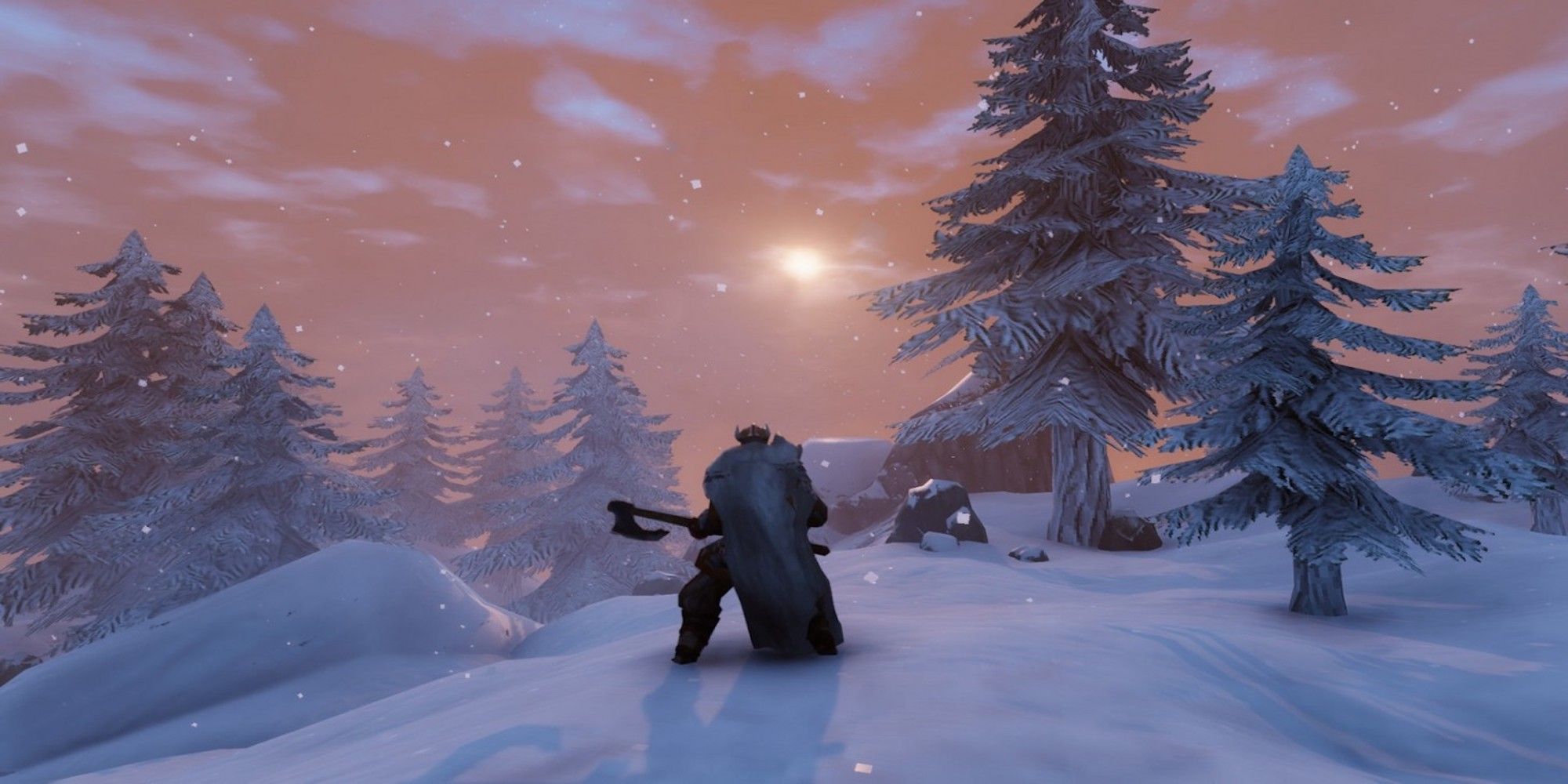 A character holding an ax on a snowy mountain in Valheim