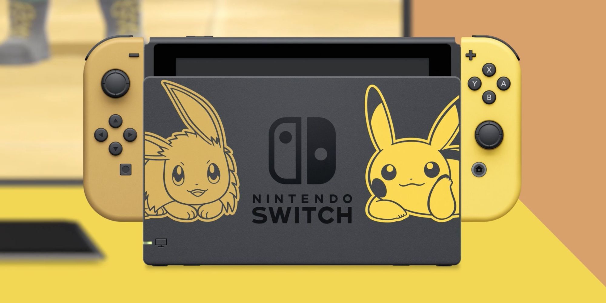 Nintendo Switch with brown and yellow Joy-Cons with Pikachu and Eevee dock designs for Pokemon Let's Go