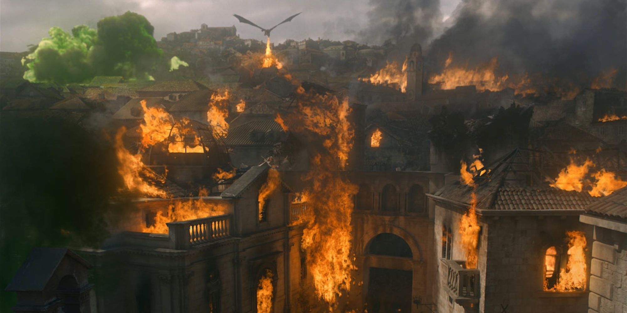 Still of King's Landing burning with a dragon overhead in Game of Thrones