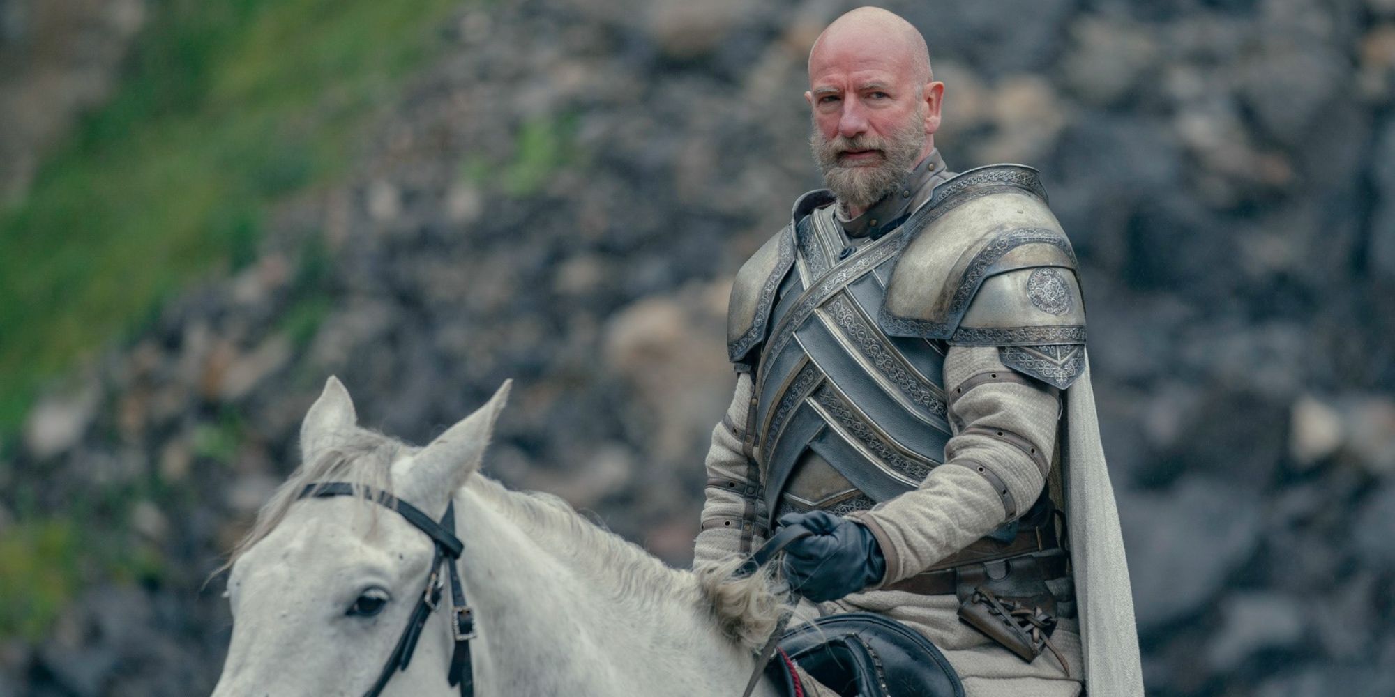 Graham McTavish as Ser Harrold Westerling riding a white horse and wearing a suit of armor in House of the Dragon