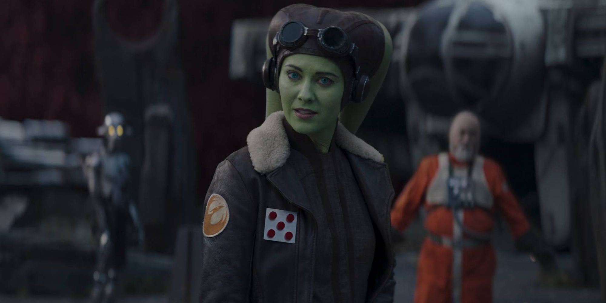 Still of Hera Syndulla standing in front of a pilot in Ahsoka