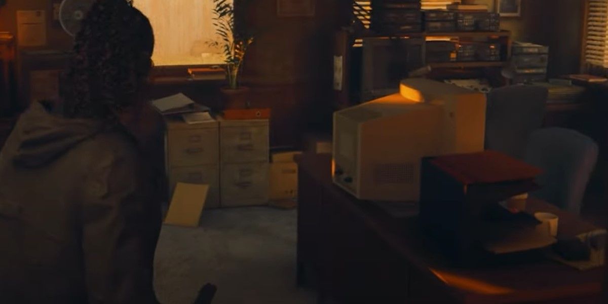 The Alan Wake 2 character is showing where the sheriff's desk is located that contains the code for the gun case.